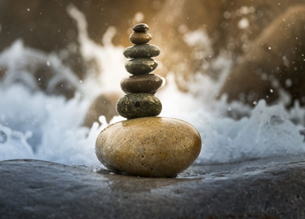 balanced stone on the river side