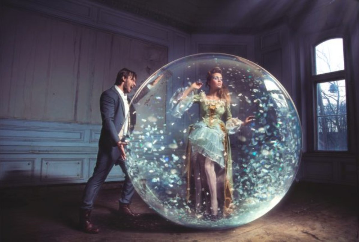 a man is screaming at a woman who is in her own bubble