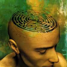 brain shaped in maze in gold colored man head