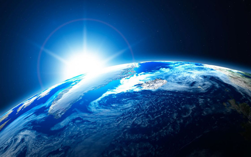 a light is rising behind the earth in blue color 